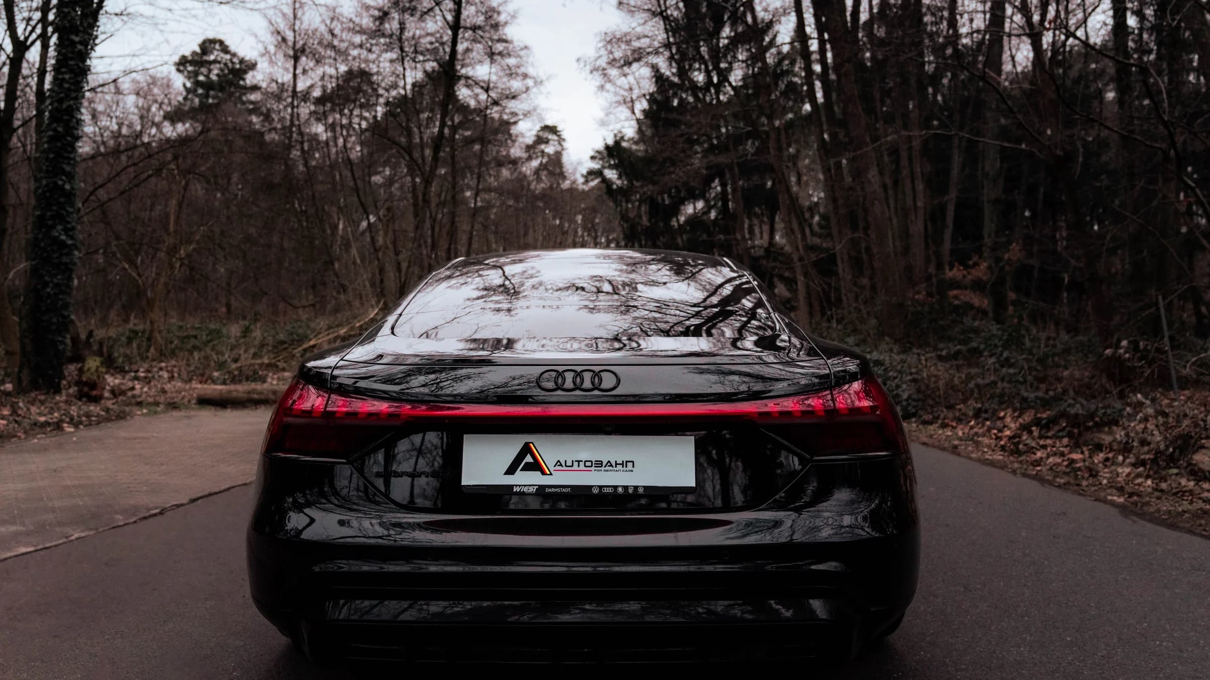 Black Audi vehicle prepared by Autobahn on a forest road